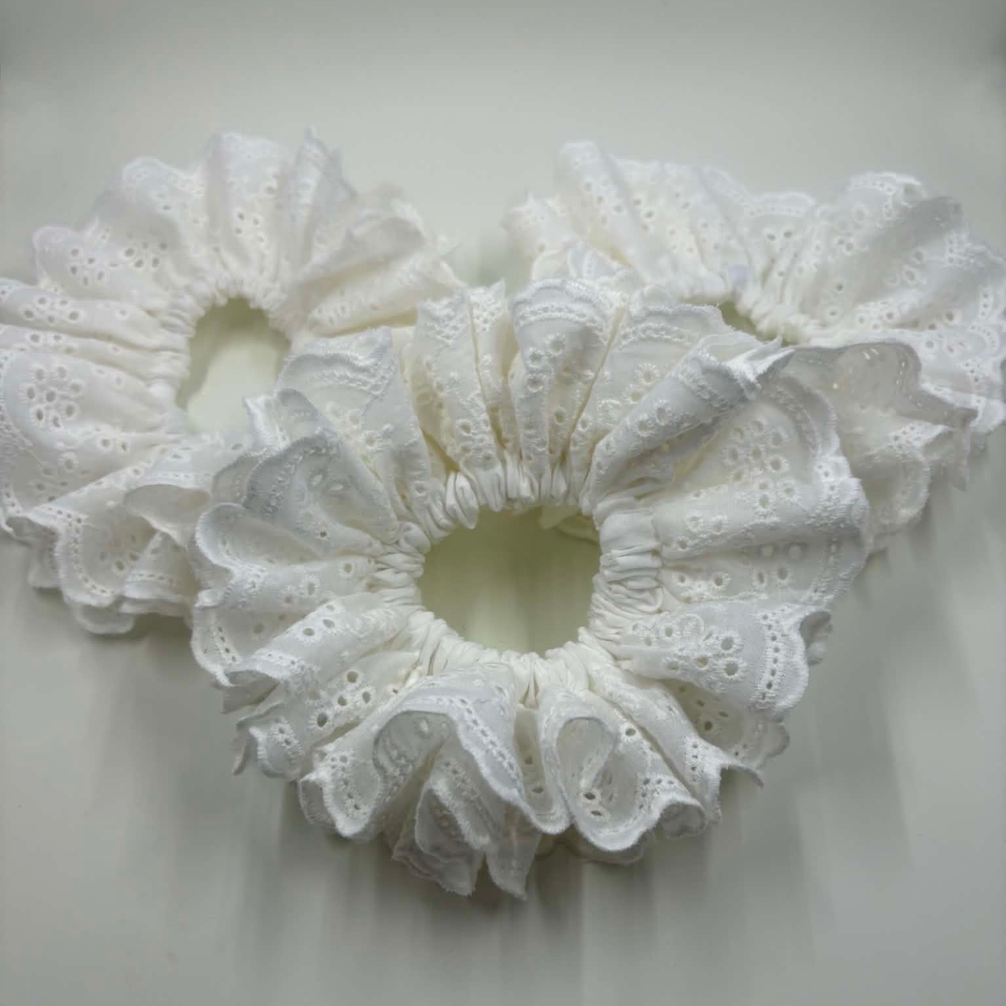 THE ISLA EYELET RUFFLED HAIR SCRUNCHIE