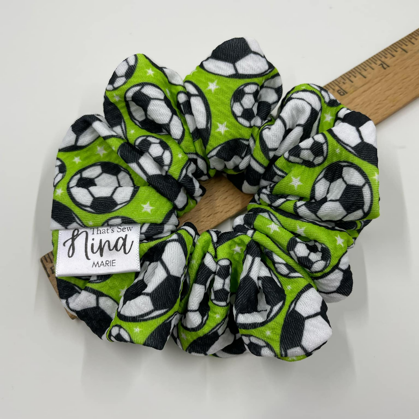 THE MANCHESTER SCRUNCHIE